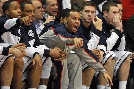 Connecticut Huskies guard Shabazz Napier (13) shouts directions to his