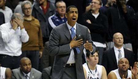 Connecticut Huskies head coach Kevin Ollie asks his players to dig into their hearts during the second overtime against Georgetown at Gampel Pavilion Wednesday night.