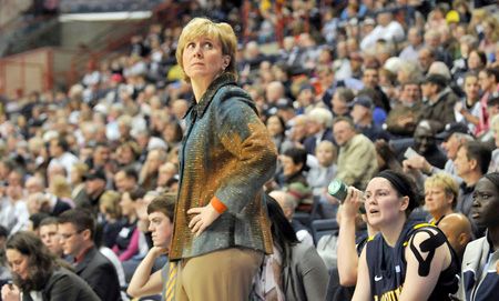 Marquette Golden Eagles head coach Terri Mitchell glances at the clock late in the first half against UConn at Gampel Pavilion Tuesday night. 
