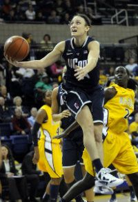  UConn guard Kelly Faris drives to the hoop against Marquette during the first half at the Al McGuire Center in Milwaukee Saturday afternoon. 