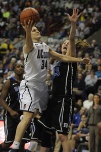 University of Connecticut Huskies guard Kelly Faris shoots over Duke Blue Devils guard/forward Haley Peters during the first half. 