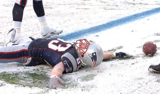 Patriots wide receiver Wes Welker (83) celebrates his touchdown by making a snow angel during New England's game against the Arizona Cardinals at Gillette Stadium - Patriots.com image