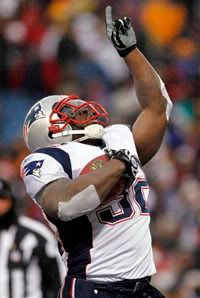 New England Patriots' LaMont Jordan (32) celebrates his touchdown during the third quarter of an NFL football game against the Buffalo Bills at Ralph Wilson Stadium - AP Photo