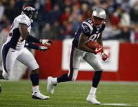 Randy Moss runs for some yardage after a catch.  Moss had two TD catches.  Patriots.com photo.  