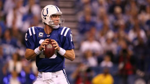 Colts QB Peyton Manning looks downfield against the Patriots for an open receiver.  Getty Photo.  