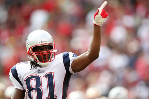 Randy Moss points to the fans after hauling in a 66-yard TD pass in the first quarter.  Getty Photo.  