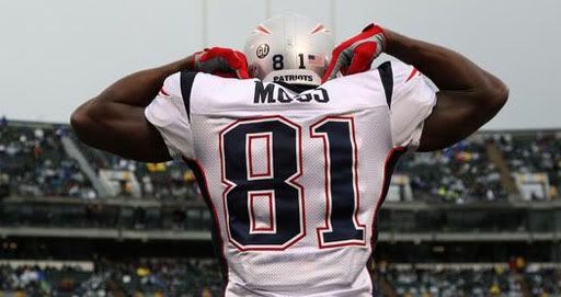 Randy Moss (81) of the New England Patriots celebrates after scoring a touchdown against the Oakland Raiders during an NFL game on December 14, 2008 at the Oakland-Alameda County Coliseum in Oakland, California. - Getty Images