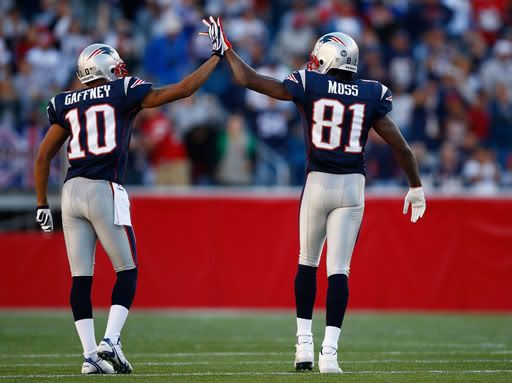 Jabar Gaffney and Randy Moss of the New England Patriots celebrate during a game against the St. Louis Rams.