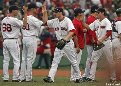 The Red Sox celebrate after beating the Jays on Sunday afternoon.