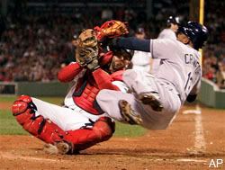 Carl Crawford tries to knock over Jason Varitek in the 8th inning.
