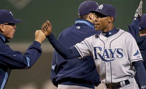 B.J. Upton and the Rays celebrate their 9-1 win in Game 3 of the ALCS.