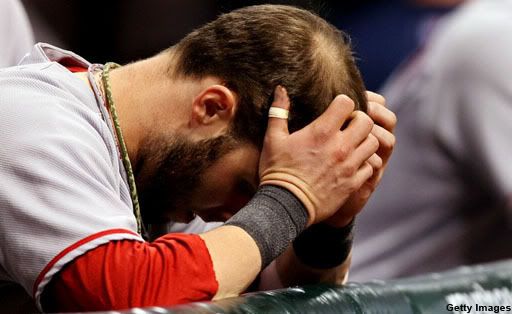 Dustin Pedroia can't bear to watch what's going on.