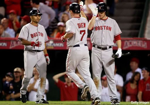 J.D. Drew celebrates after his 2-run homer gave the Red Sox a 7-5 lead in the 9th.