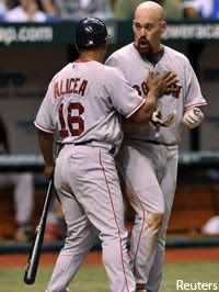 Luis Alicea holds back Kevin Youkilis