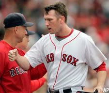 Jason Bay gets some love from the bench after scoring the 2nd run for the Red Sox.