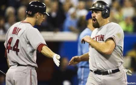 Jason Bay congratulates Kevin Youkilis after he scored in the 5th inning.