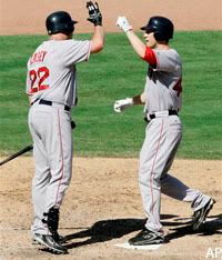 Jason Bay is congratulated by Sean Casey after his solo home run.