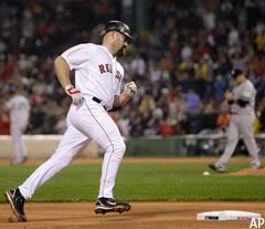 Kevin Youkilis rounds the bases after his 2-run home run.
