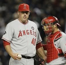 Los Angeles Angels' pitcher John Lackey, left, talks to catcher Jeff Mathis before being relieved in the sixth inning of Game 1 of the American League Championship baseball series against the New York Yankees, Friday, Oct. 16, 2009, in New York - AP Photo