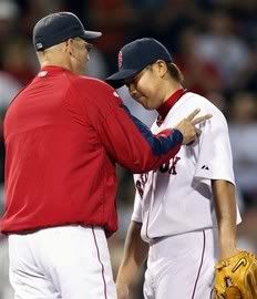 Boston Red Sox manager Terry Francona, left, takes Daisuke Matsuzaka out of the baseball game in the seventh inning against the Los Angeles Angels, Tuesday, Sept. 15, 2009, in Boston - AP Photo