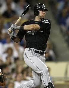 Florida Marlins' Jeremy Hermida follows through on a RBI single off of Los Angeles Dodgers pitcher Brent Leach during the seventh inning of a baseball game in Los Angeles on Friday, July 24, 2009. Cody Ross scored on the play - AP Photo