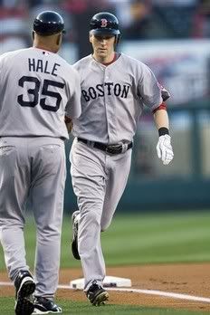 Boston Red Sox's Jason Bay, right, gets a hand slap from third base coach DeMarlo Hale after hitting a two-run home run against the Los Angeles Angels in the first inning of a baseball game in Anaheim, Calif. , Wednesday, May 13, 2009 - AP Photo