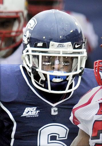 UConn's Jasper Howard moves in on a Louisville player during the game at Rentschler Field Saturday afternoon. Hours later, just after midnight, Howard was stabbed to death outside of the UConn Student Union building. The name of his hometown, Miami, is painted on his cheek - Stephen Dunn/Hartford Courant