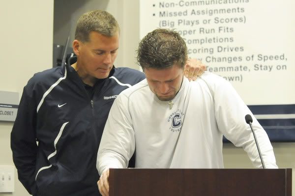 UConn coach Randy Edsall consoles punter Desi Cullen during a press conference Sunday afternoon in Storrs. Cullen spoke of his teammate Howard during the conference. (PATRICK RAYCRAFT / HARTFORD COURANT / October 18, 2009)