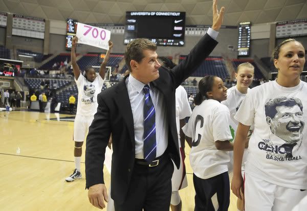 UConn coach Geno Auriemma walks off the court with his players after UConn beat Hofstra 91-46 for Auriemma's 700th career victory. UConn players, from left, are Tina Charles, Lorin Dixon, Heather Buck and Meghan Gardler - Mark Mirko/Hartford Courant