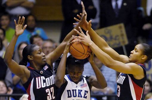UConn's Kalana Greene (32) and Maya Moore, right, pressure Duke's Bridgette Mitchell (15) during the second half - AP Photo