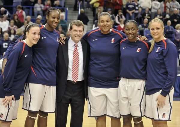 From left, UConn seniors Jacquie Fernandes, Tina Charles, Kaili McLaren, Kalana Greene and Meghan Gardler pose for a photograph with head coach Geno Auriemma, third from left, during Senior Day before the Huskies' game against Georgetown at the XL Center in Hartford (Jessica Hill/AP Photo)