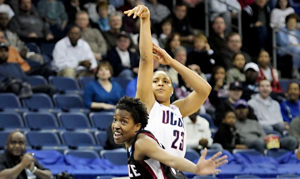 UConn's Maya Moore shoots one of her three three-pointers in the first half over Temple's Marli Bennett (Bettina Hansen/Hartford Courant)