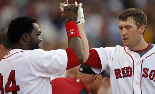 Boston Red Sox's Jason Bay (R) is congratulated by teammate David Ortiz after Bay hit a two-run home run against the Toronto Blue Jays in the first inning of their MLB American League baseball game at Fenway Park in Boston, Massachusetts May 21, 2009 - Reuters Photo