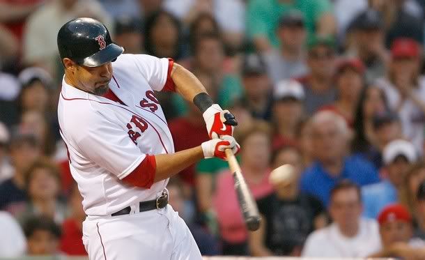 Mike Lowell #25 of the Boston Red Sox hits a home run against the New York Yankees at Fenway Park, April 25, 2009, in Boston, Massachusetts - Getty Images