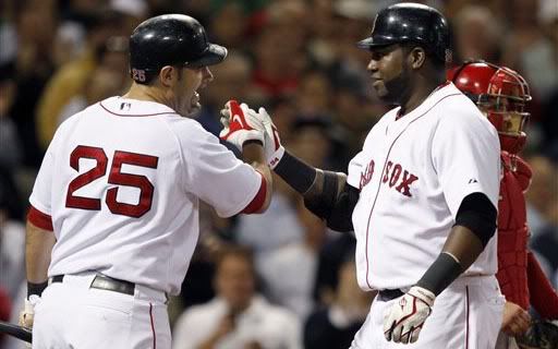 Boston Red Sox's Mike Lowell (25) congratulates David Ortiz after Ortiz hit a home run in the eighth inning of a baseball game, Tuesday, Sept. 15, 2009, in Boston. The Red Sox won 4-1.(AP Photo/Michael Dwyer)