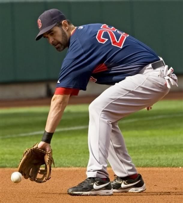 Boston Red Sox third baseman Mike Lowell fields a ball during practice in Anaheim, Calif. , Wednesday, Oct. 7, 2009, in preparation for the team's upcoming American League division series baseball game against the Los Angeles Angels - AP Photo