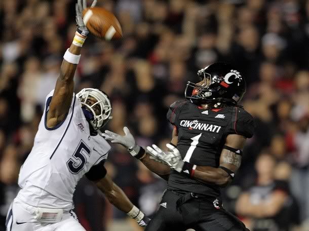 Mardy Gilyard #1 of the Cincinnati Bearcats prepares to catch a pass while defended by Blidi Wreh-Wilson #5 of the Connecticut Huskies during the Big East Conference game at Nippert Stadium on November 7, 2009 in Cincinnati, Ohio - Getty Images