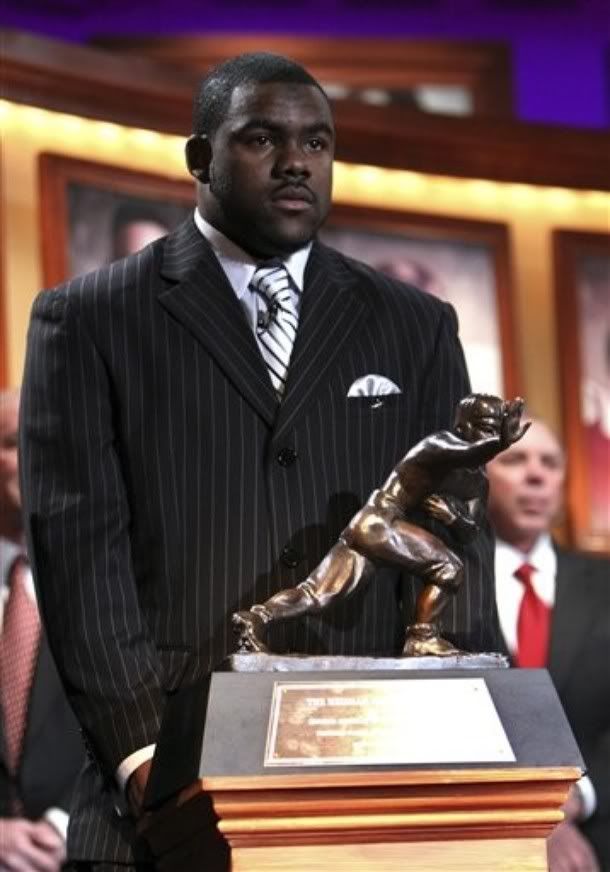 Alabama running back Mark Ingram stands with the Heisman Trophy after being named the 75th Heisman Trophy winner on Saturday, Dec. 12, 2009 in New York - AP Photo