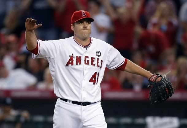 Los Angeles Angels starting pitcher John Lackey celebrates after striking out a New York Yankee to end the fourth inning in Game 5 of their Major League Baseball ALCS playoff series in Anaheim, California, October 22, 2009 - Reuters