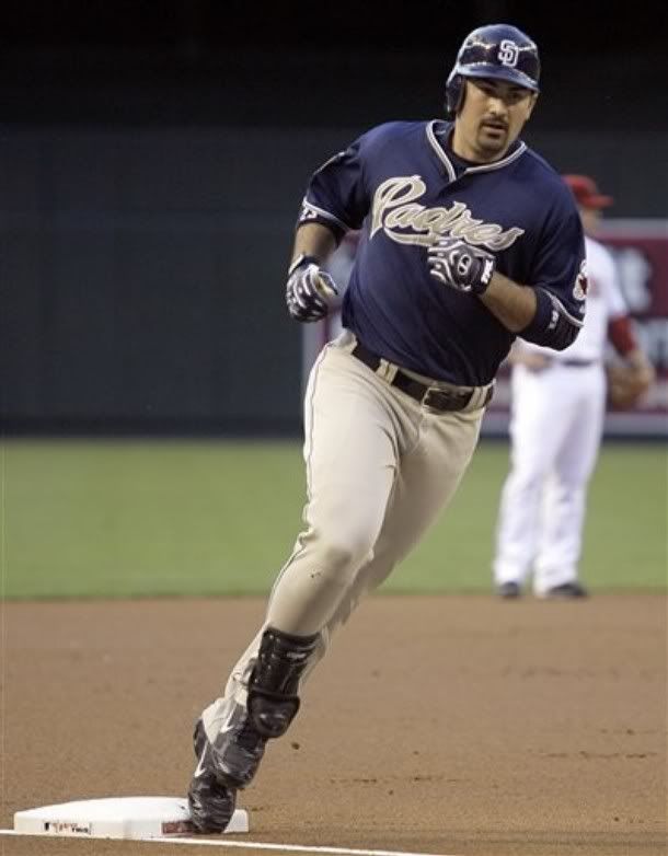 San Diego Padres' Adrian Gonzalez rounds third base after hitting a two-run home run off Arizona Diamondbacks pitcher Billy Buckner in the first inning of a baseball game Wednesday, May 27, 2009, in Phoenix. Gonzalez had three runs batted in as the Padres won 8-5. - AP Photo