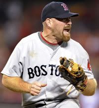 Boston Red Sox first baseman Kevin Youkilis reacts after hearing a safe call on play in which Los Angeles Angels' Howie Kendrick reached base during the sixth inning in Game 1 of the American League division baseball series Thursday, Oct. 8, 2009 in Anaheim, Calif - AP Photo