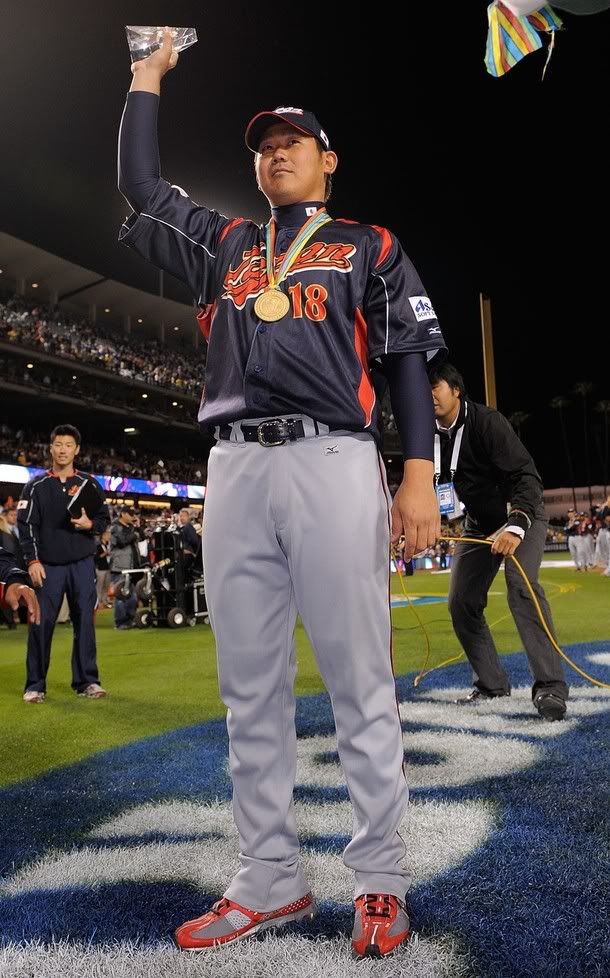 Daisuke Matsuzaka #18 of Japan holds up the the MVP trophy after defeating Korea during the finals of the 2009 World Baseball Classic on March 23, 2009 at Dodger Stadium in Los Angeles, California. Japan won 5-3 in 10 innings - Getty Images