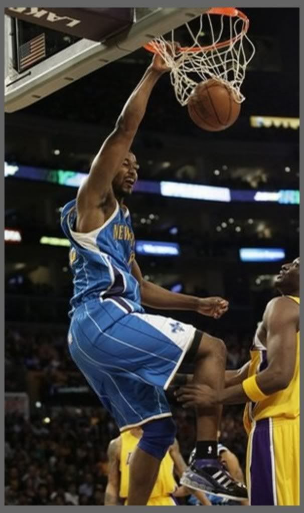 New Orleans Hornets' Hilton Armstrong, left, dunks the ball over Los Angeles Lakers' Lamar Odom during the first half of an NBA basketball game in Los Angeles on Friday, Feb. 20, 2009 - AP Photo