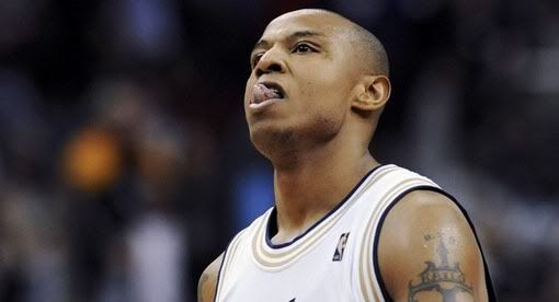 Washington Wizards guard Caron Butler licks his lips after hitting a 3-point shot to help beat the New York Knicks late in the fourth quarter of their NBA basketball game in Washington, January 16, 2009. For the game, the Wizards wore throwback jerseys from when the franchise was called the Zephyrs - Reuters Photo