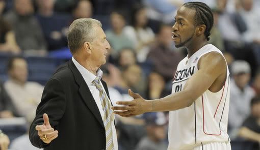 UConn Head Coach Jim Calhoun and UConn senior forward Stanley Robinson, 21, talk at half court during a time out called during second half action. The University of Connecticut played Colgate University in the first NIT season tip off at the Gampel Pavilion in Storrs Monday night. UConn won the game by a score of 77 to 63 - Richard Messina/Hartford Courant