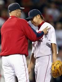 Boston Red Sox manager Terry Francona, left, takes Daisuke Matsuzaka out of the baseball game in the seventh inning against the Los Angeles Angels, Tuesday, Sept. 15, 2009, in Boston. (AP Photo/Michael Dwyer)