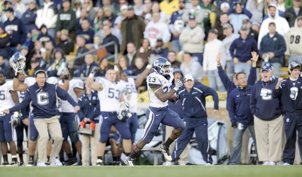 Jordan Todman has the UConn bench all worked up as he takes it to the house for a 96-yard TD to tie the score at 17 against Notre Dame Saturday afternoon. Todman amassed 286 yards total, 156 yards in kick returns and 130 yards rushing - John Woike/Hartford Courant