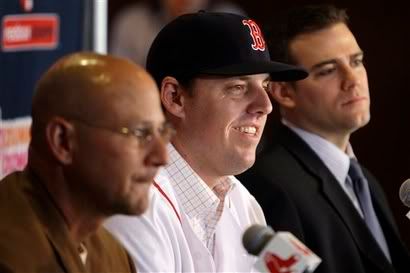 Newly-acquired Boston Red Sox pitcher John Lackey(notes), center, is flanked by manager Terry Francona, left, and general manager Theo Epstein during a baseball news conference at Fenway Park in Boston, Wednesday, Dec. 16, 200, Lackey finalized a five-year contract with the Red Sox, a deal worth $80 million to $87.5 million - AP Photo