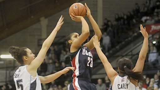 UConn's Maya Moore shoots over Villanova's Emily Suhey, left, and Jesse Carey, right, in the first half as the UConn women's basketball team takes on Villanova at The Pavilion in Villanova, Penn. Saturday Jan. 23, 2010 - Bettina Hansen/Hartford Courant