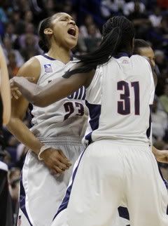 Connecticut's Maya Moore celebrates with Tina Charles (31) during the national title game
